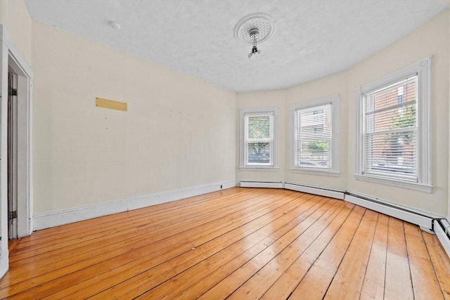 633 E Sixth St, Boston, MA 02127 - empty room with light wood-style floors, healthy amount of natural light, and baseboards