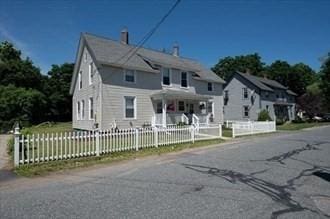 16-18 Orchard St, Grafton, MA 01560 - view of front facade featuring a fenced front yard and a porch
