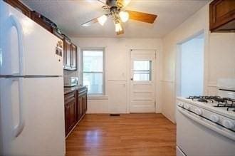 16-18 Orchard St, Grafton, MA 01560 - kitchen featuring white appliances, light wood finished floors, and ceiling fan