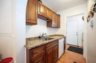 16-18 Orchard St, Grafton, MA 01560 - kitchen with dishwasher, light stone counters, and light wood-type flooring