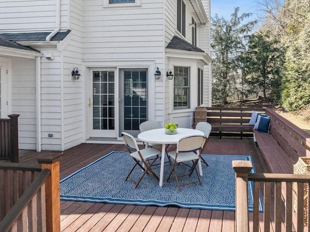 deck featuring outdoor dining area