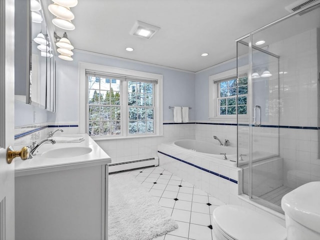 bathroom featuring toilet, visible vents, baseboard heating, and plenty of natural light