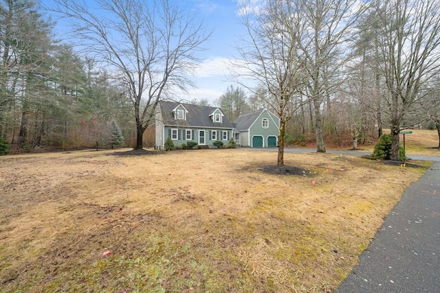 view of front of property with a garage and driveway