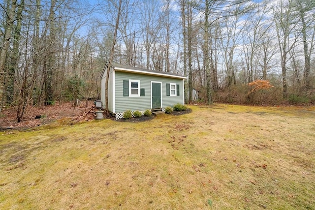 exterior space featuring entry steps and a front yard