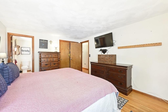 81 Crosstown Ave, Boston, MA 02132 - bedroom with light wood-style flooring, baseboards, a closet, and connected bathroom