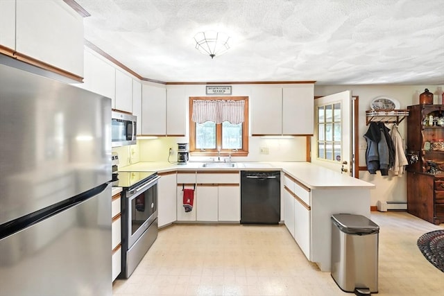 81 Crosstown Ave, Boston, MA 02132 - kitchen with stainless steel appliances, a peninsula, a sink, a baseboard radiator, and light floors