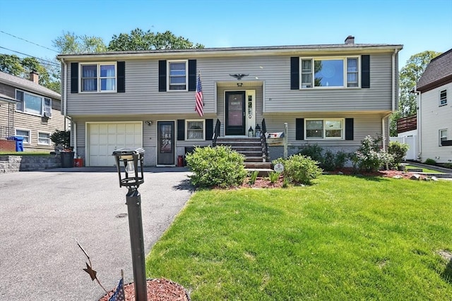 81 Crosstown Ave, Boston, MA 02132 - split foyer home featuring driveway, a garage, a front yard, and a chimney