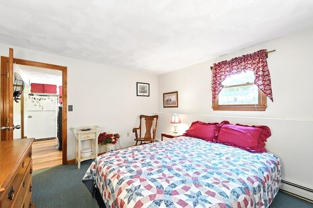 81 Crosstown Ave, Boston, MA 02132 - bedroom with freestanding refrigerator, a baseboard radiator, and carpet flooring