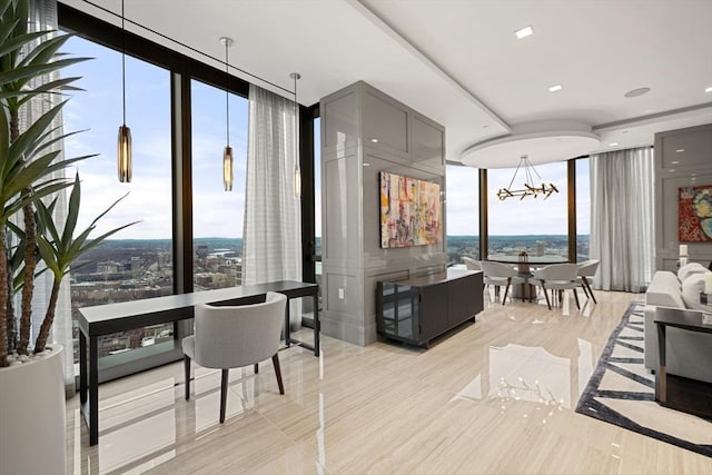 living room with a chandelier and expansive windows