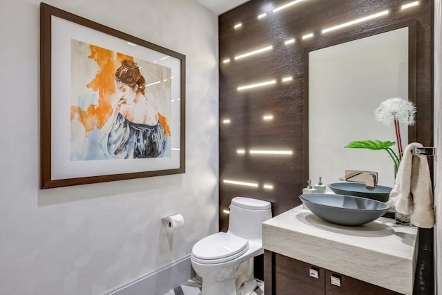 bathroom with toilet and vanity