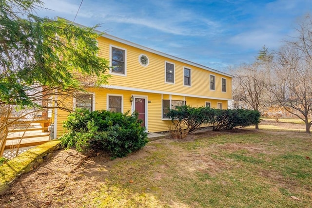 view of front of house with a front lawn