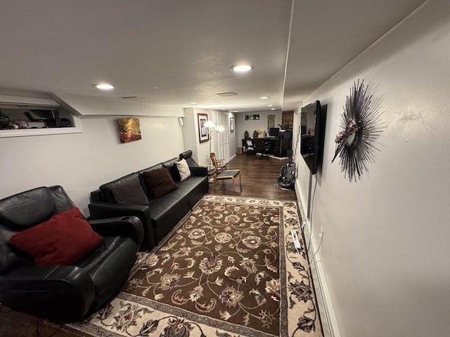 living area with recessed lighting and dark wood-style floors