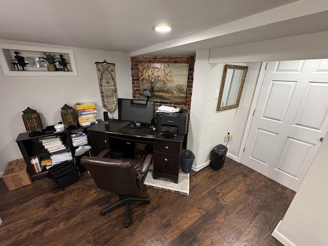 office area with dark wood-style floors and baseboards