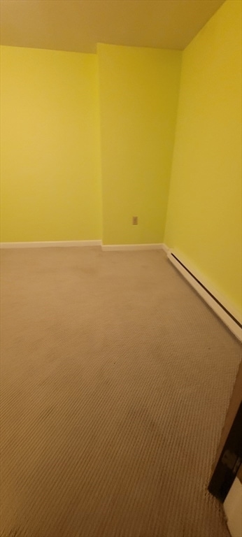 empty room featuring carpet flooring