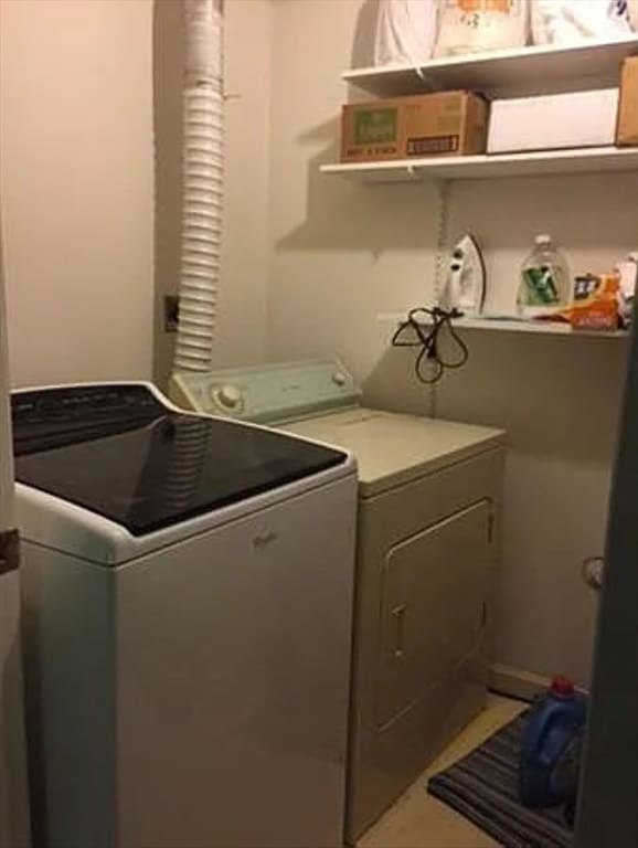 clothes washing area with washer and dryer