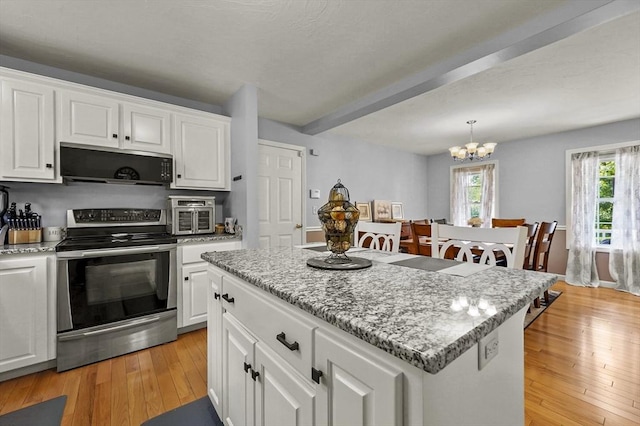 3 Spindletop Dr, Leominster, MA 01453 - kitchen with electric range, a chandelier, white cabinetry, light wood finished floors, and beam ceiling