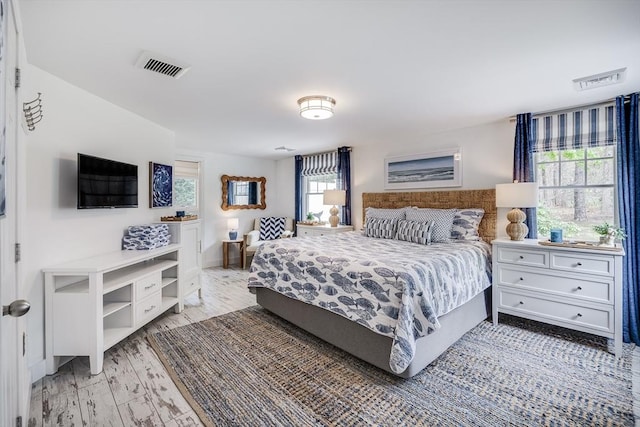 bedroom featuring light wood-style floors