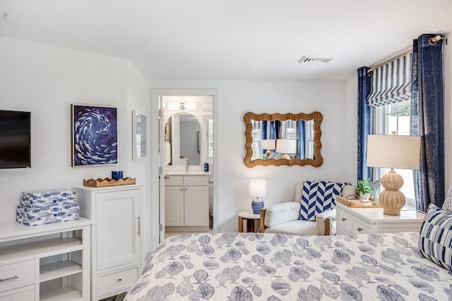 bedroom featuring ensuite bathroom