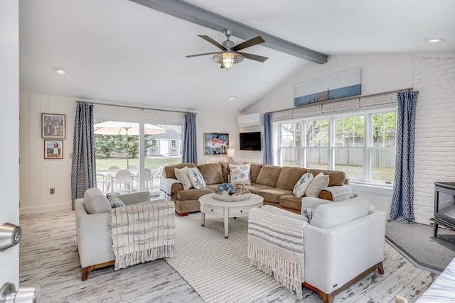 living room featuring a wood stove, ceiling fan, a wall mounted AC, light wood-style floors, and recessed lighting