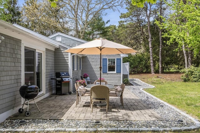 view of patio / terrace with a grill and outdoor dining space