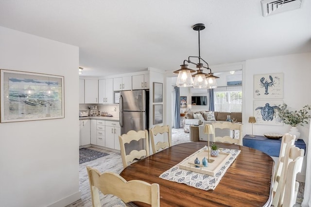 dining room with light wood-style floors