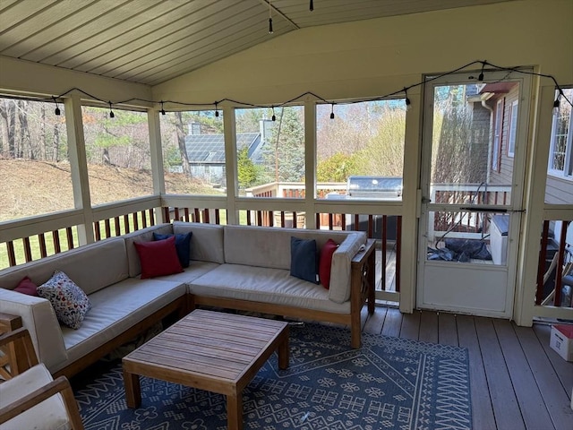 sunroom with plenty of natural light and an outdoor hangout area