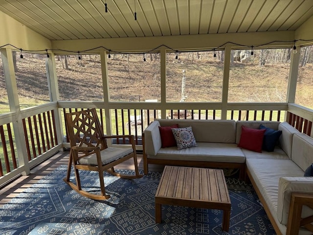wooden terrace with outdoor lounge area