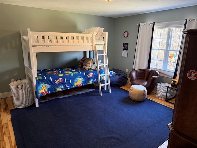 bedroom with wood finished floors