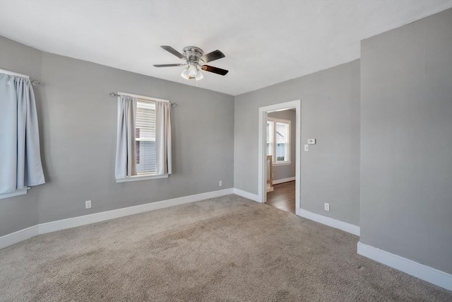 unfurnished room featuring carpet flooring and ceiling fan