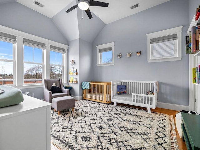 49 Coffey St Unit B, Boston, MA 02122 - bedroom featuring a crib, wood finished floors, lofted ceiling, baseboards, and ceiling fan