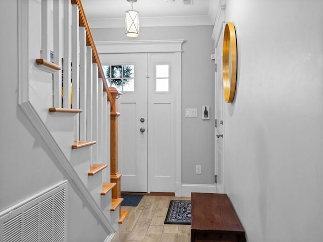 49 Coffey St Unit B, Boston, MA 02122 - foyer entrance with stairs, crown molding, and wood finished floors