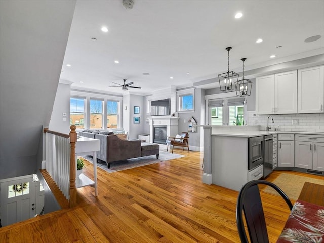 49 Coffey St Unit B, Boston, MA 02122 - kitchen featuring a peninsula, recessed lighting, backsplash, light wood-style flooring, and open floor plan