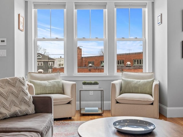 49 Coffey St Unit B, Boston, MA 02122 - sitting room featuring healthy amount of natural light, wood finished floors, and baseboards