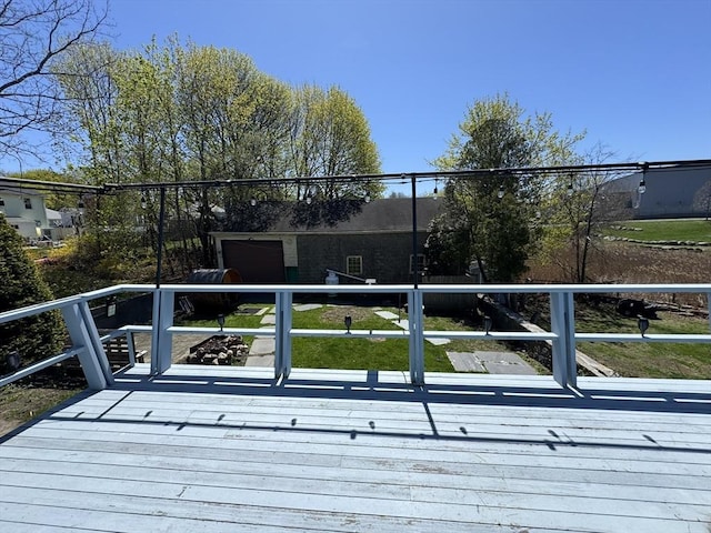 wooden deck featuring an attached garage