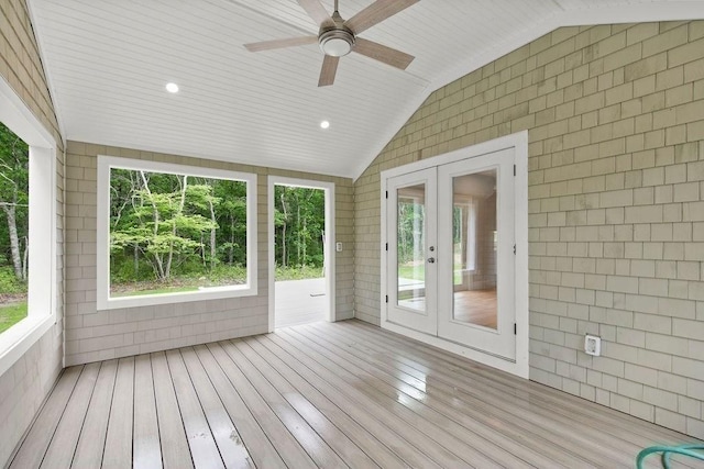 unfurnished sunroom featuring wooden ceiling, ceiling fan, french doors, and vaulted ceiling