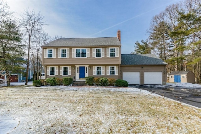 colonial home with a garage