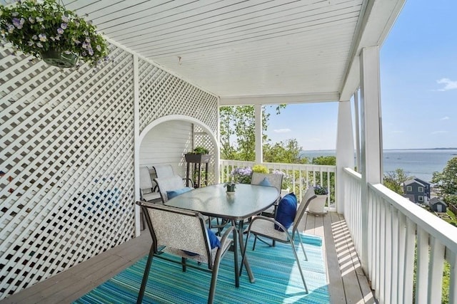 wooden deck with outdoor dining space