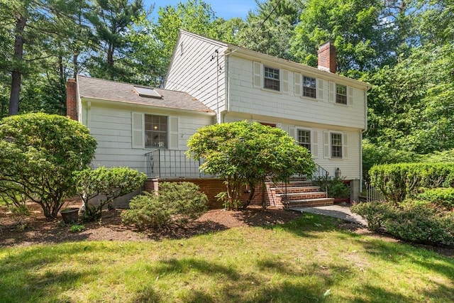 3 Marshall St, North Reading, MA 01864 - colonial-style house with a chimney and a front lawn