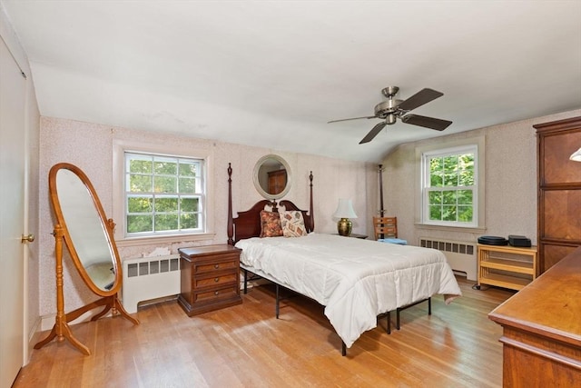 3 Marshall St, North Reading, MA 01864 - bedroom featuring radiator, light wood-style flooring, multiple windows, wallpapered walls, and lofted ceiling