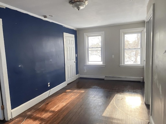 unfurnished room with dark hardwood / wood-style floors and ornamental molding