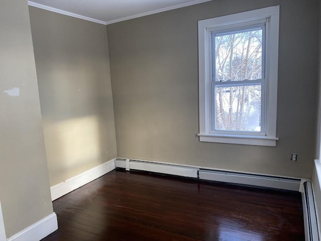 spare room featuring a baseboard radiator, dark hardwood / wood-style floors, and ornamental molding