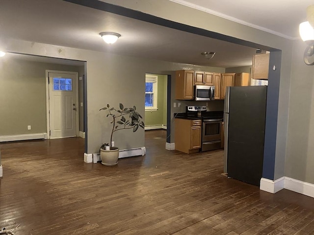 kitchen with dark wood-type flooring, appliances with stainless steel finishes, ornamental molding, and a baseboard heating unit