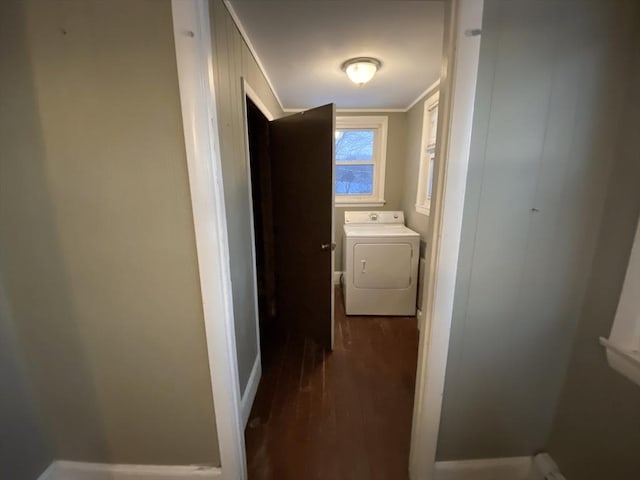 corridor featuring vaulted ceiling, dark wood-type flooring, and washer / dryer