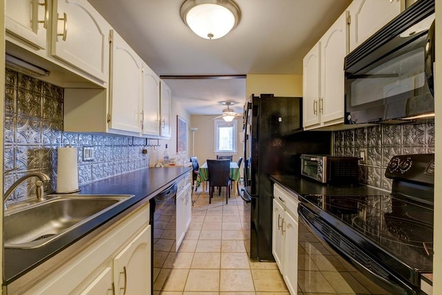 15 Foundry St Unit B1, Easton, MA 02375 - kitchen with black appliances, dark countertops, backsplash, light tile patterned floors, and white cabinets