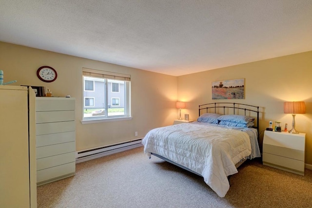 15 Foundry St Unit B1, Easton, MA 02375 - bedroom featuring a baseboard heating unit, carpet flooring, and a textured ceiling