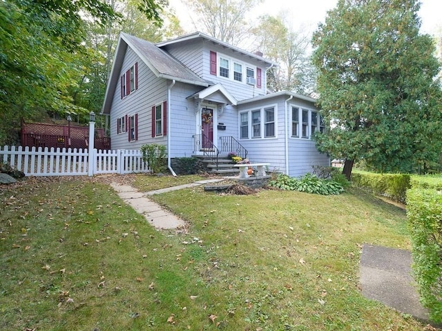 front of property featuring a front lawn