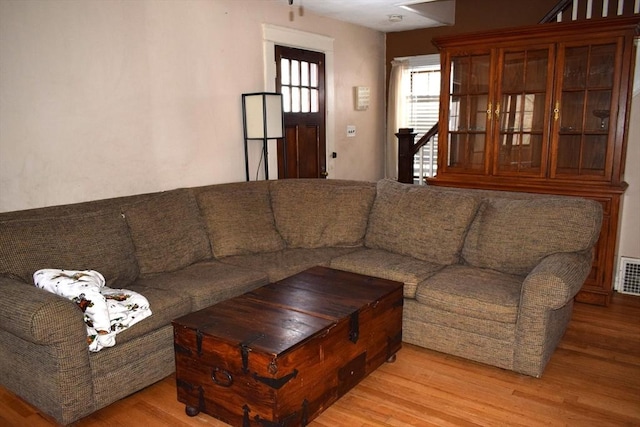 living room with light hardwood / wood-style floors