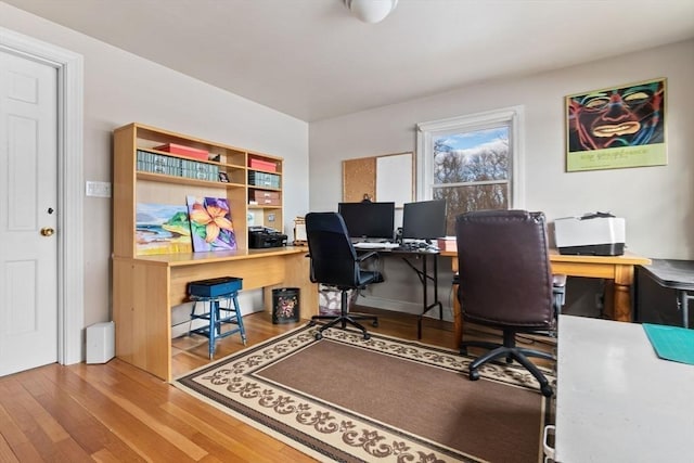 home office with wood finished floors