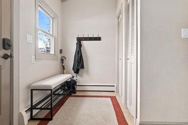 doorway to outside featuring a baseboard radiator