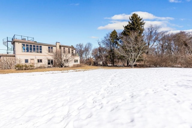 view of yard covered in snow